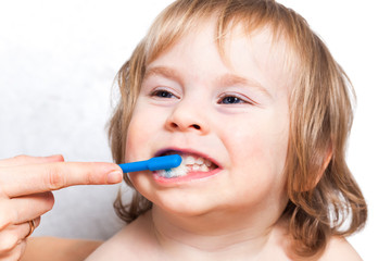 Mom brush cleans teeth funny blond kid 2 years
