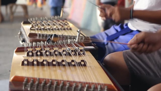 Thai wooden dulcimer musical instrument performing