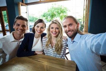 Young friends having fun in café