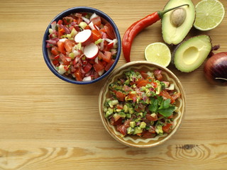 Mexican food. Salsa sauce from raw vegetables, two different options.