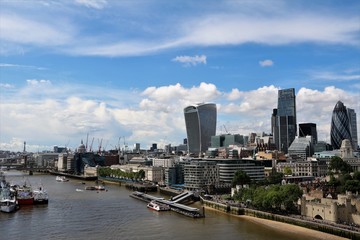 View from Tower Bridge to Tower of London, the Gherkin and Skyscrapers in London, UK 