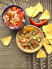 Mexican food. Salsa sauce from raw vegetables, two different options.