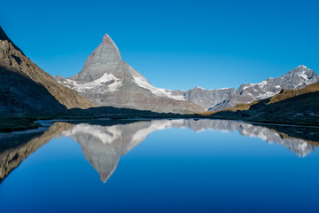 View on Matterhorn reflected in Lake  Riffelsee, near Zermatt, Switzerland.