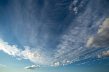 Blue sky with white fluffy clouds. Sky daylight. Natural sky composition.