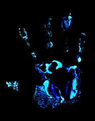 Handprint on black background. Handprint with ultraviolet lamp.