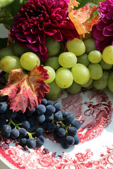 Still life flower decoration with grapes in autumn