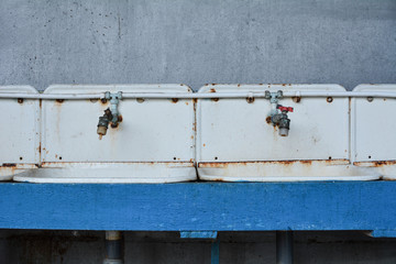 Old washbasins rusty non-working