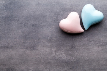 Fototapeta premium Colored heart on the gray background. View from above. Flat lay.