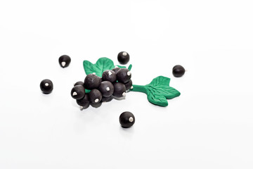 Black currant made from plasticine.