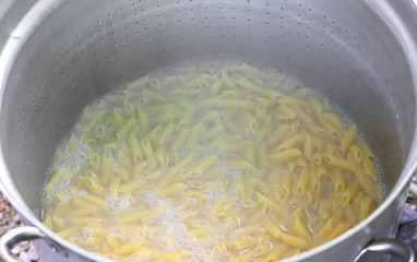 pasta called MEZZE PENNE in Italy cooked in the boiling water