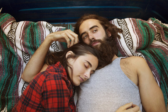 Young couple relaxing on blanket