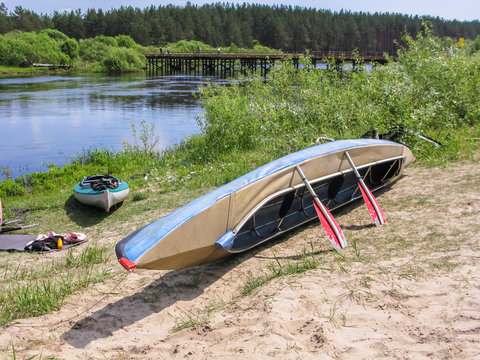 Kayak dry on the river bank after a hike