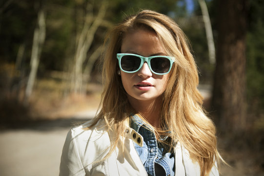 Portrait of blond woman wearing sunglasses