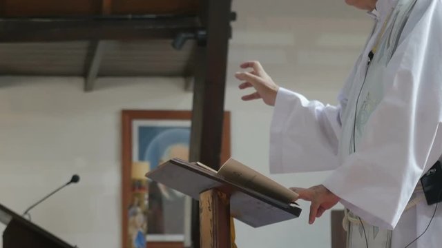 Priest moving hands