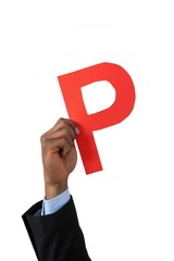 Businessman holding an alphabet p