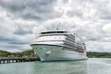 big cruise ship, white luxury yacht in sea port, Antigua