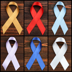 Set of symbolic ribbons on wooden background