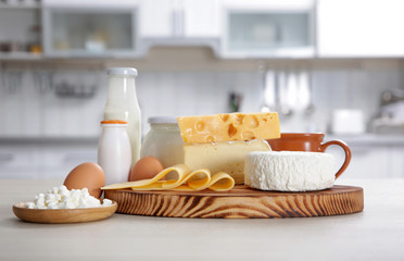 Different dairy products on kitchen table
