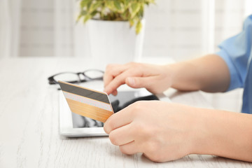 Internet shopping concept. Woman paying online order with credit card