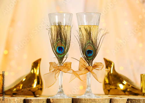 "Decorated champagne glasses for wedding on table" Stock photo and