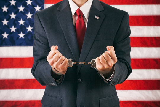 Politician: Man With Hands In Handcuffs