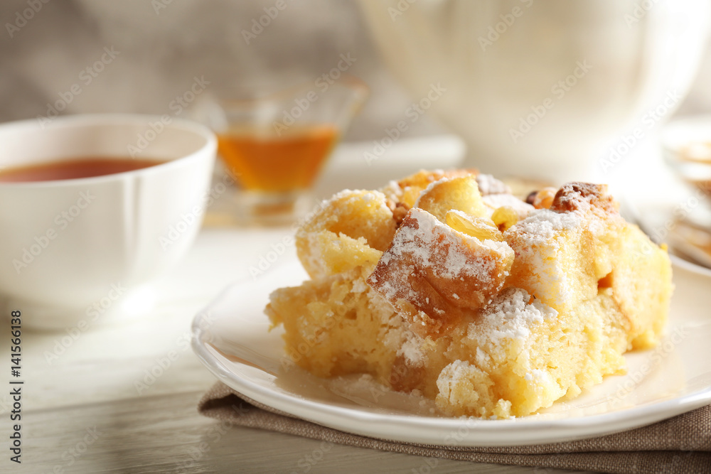 Poster Delicious bread pudding with sugar powder on plate