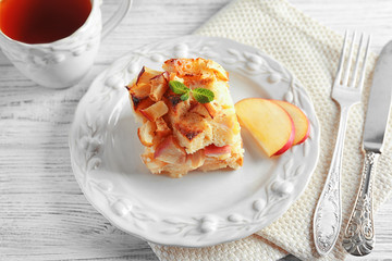 Delicious bread pudding with apple on plate