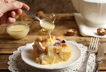 Tasty bread pudding with sugar powder on plate