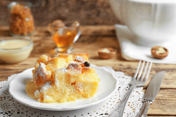 Tasty bread pudding with sugar powder on plate