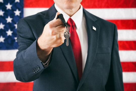 Politician: Man Holding Out Ring Of Keys