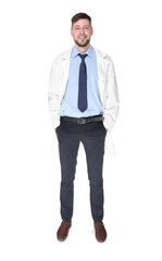 Young handsome pharmacist standing on white background