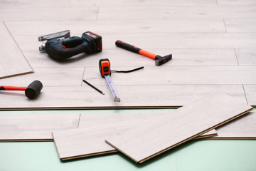 Laminate installing equipment on planks