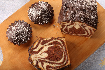 Marble easter cake with chocolate on wooden board