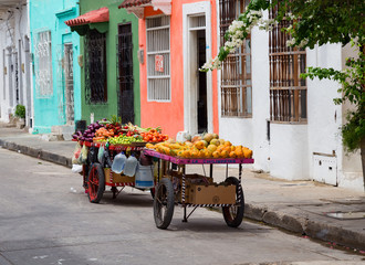 A fruit cart sits on the side of the road in the Getsemani neighborhood of Cartagena, Colombia. © Danaan