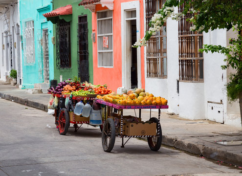 A fruit cart sits on the side of the road in the Getsemani neighborhood of Cartagena, Colombia.