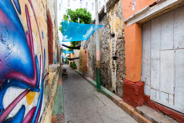 Vibrant street art in an alley in the Getsemani neighborhood of Cartagena, Colombia.