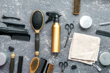 hair cutting preparation with hairdresser tools on desk background top view