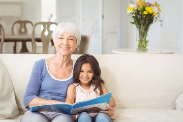 Smiling grandmother and granddaughter