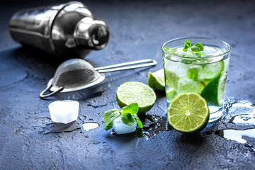 mojito in glass on dark background close up