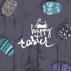 Easter eggs on wooden board.  Happy Easter greetings card