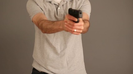 Man demonstrating concealed carry gun draw