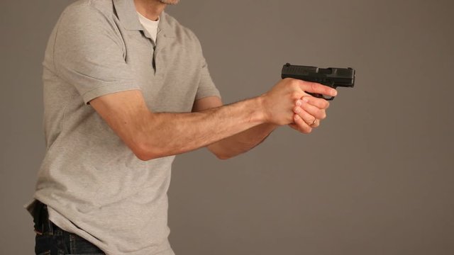 Man demonstrating concealed carry gun draw
