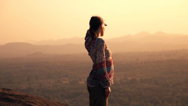 Young woman admire sunset and landscape standing on hill, super slow motion 240fps
