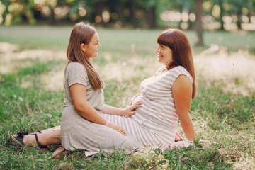 Fototapeta premium Pregnant mother and daughter