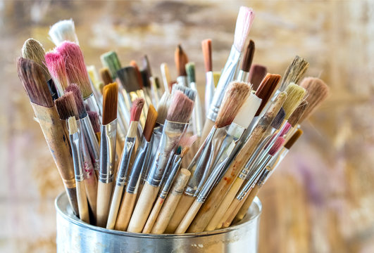 Artist Paint Brushes. Used kit paint brushes in can. Close-up.