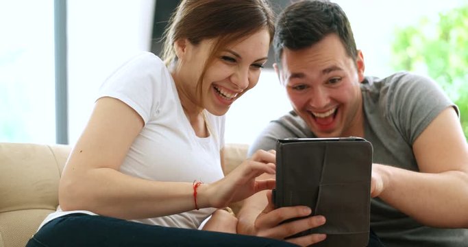Young Couple using interent on digital tablet