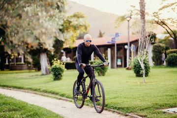 Fototapeta premium Man Cycling in Park