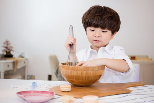 Asian Chinese little boy prepare for baking cookies