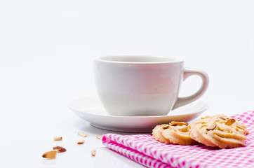 Obraz na płótnie Canvas Empty coffee cup waiting to be filled. And cookies on white background