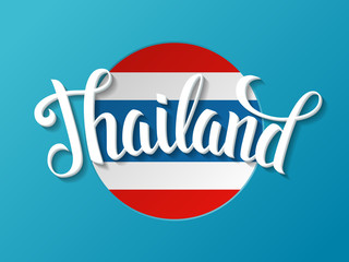 Fototapeta premium Thailand lettering on the national flag background. Vector hand drawn typography poster. Vintage calligraphic design.